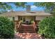 Back of the house with a raised deck, stairs, and a garden at 1250 Wide Water Ct, Charleston, SC 29412