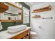 Charming bathroom with a vessel sink, wood accents, and decorative shelving for storage at 1250 Wide Water Ct, Charleston, SC 29412