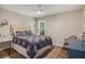 Bright bedroom with a decorative bedspread and a stylish wooden writing desk at 1250 Wide Water Ct, Charleston, SC 29412