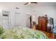 Bright primary bedroom boasts hardwood floors, a ceiling fan, and ample closet space at 1250 Wide Water Ct, Charleston, SC 29412