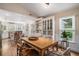 Inviting dining area with hardwood floors, built-in cabinets, and natural light at 1250 Wide Water Ct, Charleston, SC 29412