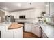 Bright kitchen features white cabinetry, granite countertops, stainless steel appliances, and hardwood floors at 1250 Wide Water Ct, Charleston, SC 29412