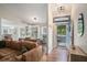 Open-concept living room seamlessly connects to dining area, complemented by wood floors and abundant natural light at 1250 Wide Water Ct, Charleston, SC 29412