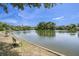 Scenic view of pond with benches and lush trees, creating a serene and tranquil outdoor space at 1250 Wide Water Ct, Charleston, SC 29412
