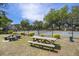 Tennis court with picnic tables and greenery, perfect for recreation and relaxation in the community at 1250 Wide Water Ct, Charleston, SC 29412
