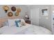 Comfortable bedroom showcasing a well-decorated bed with decorative pillows and stylish wall decor at 130 River Landing Dr # 3202, Charleston, SC 29492