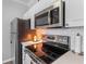 Close up of a well-equipped kitchen with stainless steel appliances and modern lighting at 130 River Landing Dr # 3202, Charleston, SC 29492