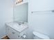 Bathroom featuring a clean white vanity, ample counter space, a large mirror, and a toilet at 130 River Landing Dr # 7106, Charleston, SC 29492
