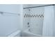 Bathroom showing a shower and tub combination with neutral tile, a toilet, and a towel bar at 130 River Landing Dr # 7106, Charleston, SC 29492