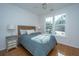 Bright bedroom with large windows, wood floors, stylish decor, and abundant natural light at 130 River Landing Dr # 7106, Charleston, SC 29492