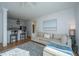 Bright and airy living room featuring stylish seating, bar stools, and hardwood floors at 130 River Landing Dr # 7106, Charleston, SC 29492