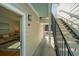 Exterior view of the home's staircase leading to a unit, showcasing a glimpse of the interior living area at 130 River Landing Dr # 7106, Charleston, SC 29492