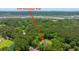 Wide aerial shot of 1375 Tannanger Trail showcases wooded property with private home nestled in nature at 1375 Tannanger Trl, Awendaw, SC 29429