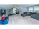 Finished bonus room with workout area, large gray sectional couch, and plush carpeting at 1375 Tannanger Trl, Awendaw, SC 29429