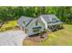 Aerial view of the home with attached garage and cozy front porch with patriotic flair at 1375 Tannanger Trl, Awendaw, SC 29429