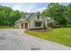 Beautiful two-story home with a two-car garage and a gravel driveway at 1375 Tannanger Trl, Awendaw, SC 29429