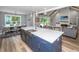 Open concept kitchen showcasing a large island with seating and a clear view of the dining and living areas at 1375 Tannanger Trl, Awendaw, SC 29429