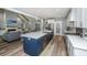 Bright, open kitchen featuring stainless steel appliances, a large island, and views to the living area at 1375 Tannanger Trl, Awendaw, SC 29429