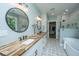 Bathroom featuring a soaking tub, tiled shower, walk-in closet, double sink vanity, and patterned floors at 1375 Tannanger Trl, Awendaw, SC 29429