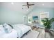 Bedroom featuring a bed, wood ceiling fan, wood floors, and natural light from several windows at 1375 Tannanger Trl, Awendaw, SC 29429
