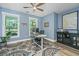 Office space featuring blue walls, a large window, and a view to the outside yard at 1375 Tannanger Trl, Awendaw, SC 29429