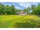 A well-manicured yard surrounds this beautiful house with a serene, green landscape at 1375 Tannanger Trl, Awendaw, SC 29429