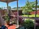 Screened-in porch view of backyard with lush landscaping and a variety of plants at 1401 Dabbling Duck Dr, Summerville, SC 29483