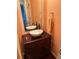 Charming bathroom showcasing a bowl sink and wooden vanity with dark wood flooring at 1401 Dabbling Duck Dr, Summerville, SC 29483