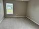 Spacious bedroom with a window offering natural light, and neutral carpet offering comfort and versatility at 1401 Dabbling Duck Dr, Summerville, SC 29483