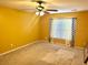 Bedroom featuring a ceiling fan and a window with patterned curtains, offering potential updates at 1401 Dabbling Duck Dr, Summerville, SC 29483