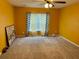 Bedroom featuring a ceiling fan and a window with patterned curtains, offering potential updates at 1401 Dabbling Duck Dr, Summerville, SC 29483