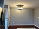 View of dining room featuring hardwood floors, a modern light fixture, a rear door, and a neutral paint palette at 1401 Dabbling Duck Dr, Summerville, SC 29483