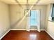 Hardwood floored dining area with a modern light fixture, window, and decor-ready neutral paint at 1401 Dabbling Duck Dr, Summerville, SC 29483