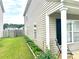 Exterior view of house with green grass and green garden bed at 1401 Dabbling Duck Dr, Summerville, SC 29483