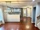 Open-concept kitchen features stainless steel appliances, modern lighting, and hardwood floors extending into the dining area at 1401 Dabbling Duck Dr, Summerville, SC 29483