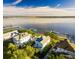 Stunning aerial view of waterfront home with private dock, situated on a picturesque river at 1410 Smythe St, Charleston, SC 29492