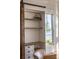 Stylish shelving and cabinets surround a bright window with views of the coast at 1410 Smythe St, Charleston, SC 29492