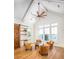 Bright and airy living room featuring vaulted ceilings, shiplap walls, and picturesque waterfront views at 1410 Smythe St, Charleston, SC 29492
