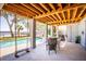 Outdoor patio with pool, swing, and dining area, perfect for relaxing and entertaining at 1410 Smythe St, Charleston, SC 29492