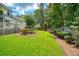 A lush backyard featuring a well-manicured lawn and mature landscaping, creating a private outdoor oasis at 143 Belleplaine Dr, Goose Creek, SC 29445