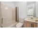 A bathroom featuring a tub with shower head, toilet and sink vanity with a mirror at 143 Belleplaine Dr, Goose Creek, SC 29445