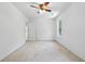 Clean bedroom featuring neutral carpeting, a ceiling fan, and a window at 143 Belleplaine Dr, Goose Creek, SC 29445