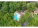 Overhead shot of a community pool surrounded by parking and mature trees at 143 Belleplaine Dr, Goose Creek, SC 29445