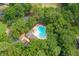 Overhead shot of community pool with lounge chairs surrounded by lush greenery at 143 Belleplaine Dr, Goose Creek, SC 29445