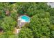 Aerial view of a sparkling community pool nestled amongst lush, mature trees at 143 Belleplaine Dr, Goose Creek, SC 29445