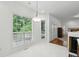 Dining area with backyard view and hardwood floors at 143 Belleplaine Dr, Goose Creek, SC 29445