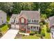 Traditional two-story home with brick facade, well-maintained landscaping, and inviting front porch at 143 Belleplaine Dr, Goose Creek, SC 29445