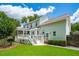 An expansive backyard view featuring a deck and sunroom that enhance the property's appeal at 143 Belleplaine Dr, Goose Creek, SC 29445