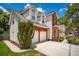 Charming two-story home boasts a brick and siding facade, with an attached two-car garage and mature landscaping at 143 Belleplaine Dr, Goose Creek, SC 29445