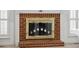 Brick fireplace with gold screen and glass doors at 143 Belleplaine Dr, Goose Creek, SC 29445
